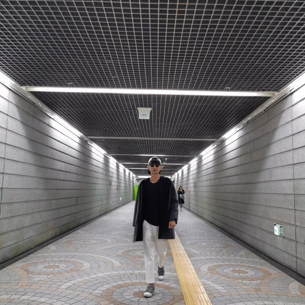 Empty subway corridor with tiled walls